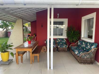 Casa de Condomínio Para Vender com 4 quartos 4 suítes no bairro Guarajuba em Camaçari