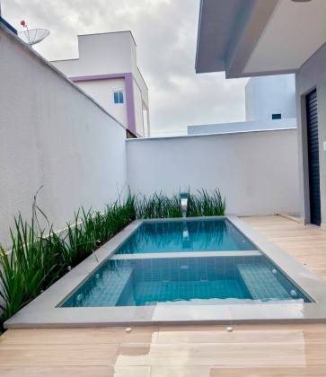 Casa de Condomínio Padrão Americano com 3 suítes no