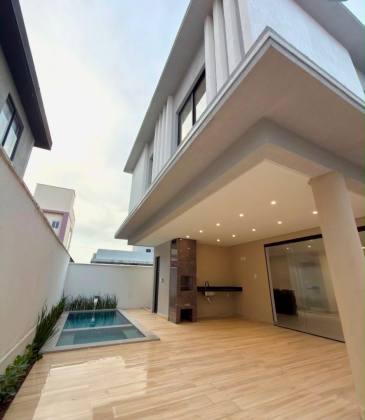 Casa de Condomínio Padrão Americano com 3 suítes no